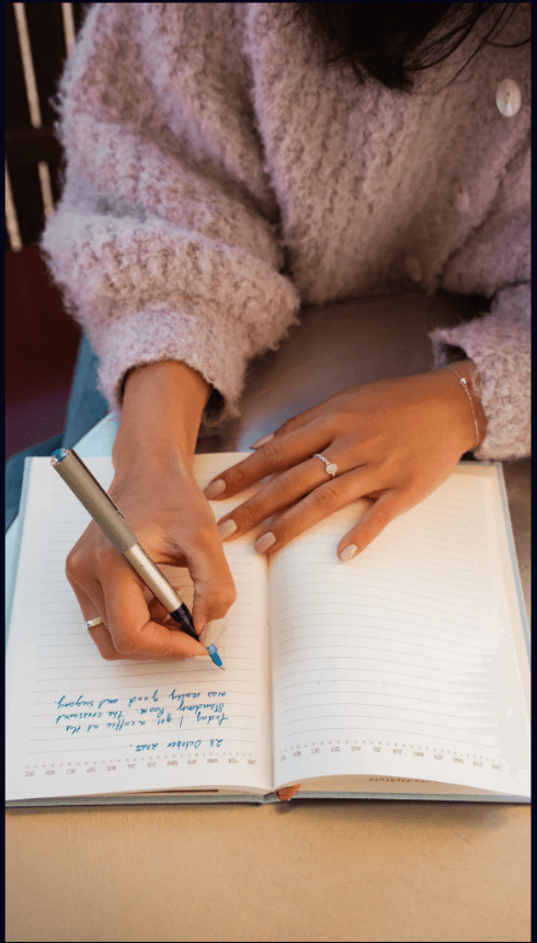 Person writing in a journal